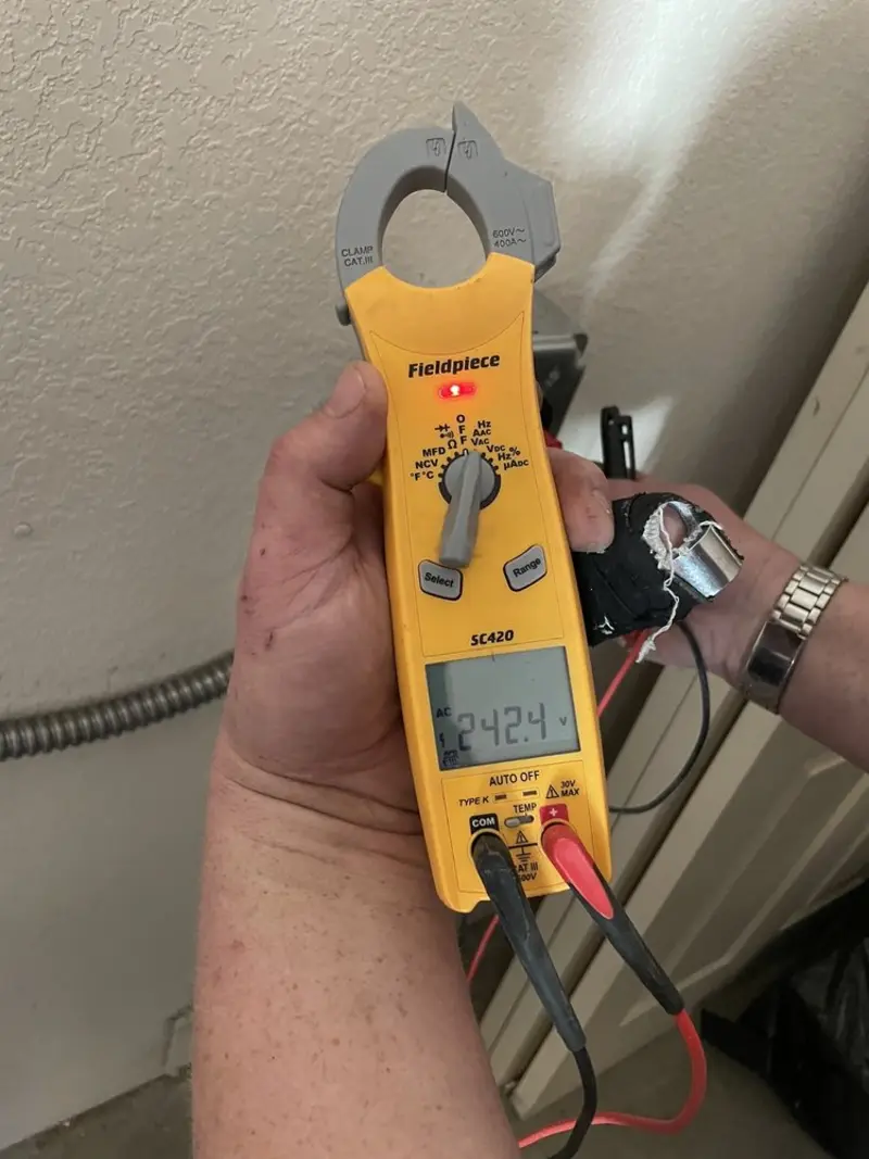 Voltage testing with clamp meter during Electrical Installation Services in Beechwood